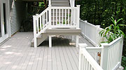 Composite Deck with vinyl railing by Elyria Fence